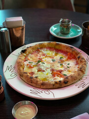 Indulge in a Delicious WoodFired Pizza that is Thoughtfully Served with a Tasty Dipping Sauce