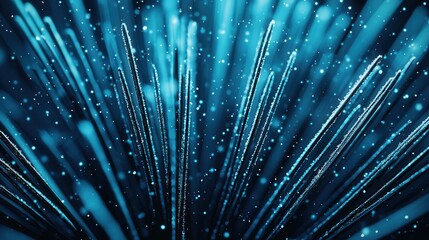 Abstract blue light streaks with glowing particles create dynamic visual effect