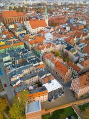 Naklejka premium Aerial view of historical buildings and roofs in Polish medieval town of Torun where Nicolaus Copernicus was born.