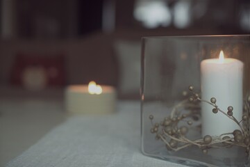 Assorted Christmas candles on a coffee table during the holiday season
