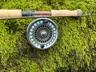 Fly fishing reel and rod with thick green moss