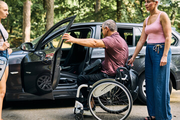 Man in Wheelchair Assisting