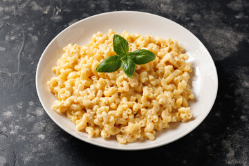 Creamy mac and cheese macaroni in a white bowl