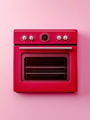Obraz premium A modern red oven stands out against a bright pink background, symbolizing a fresh start, vibrant energy, and the joy of cooking and baking.