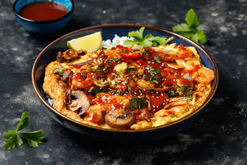 Foo Young Chinese egg omelette filled with vegetables, mushrooms, shrimp and sauce
