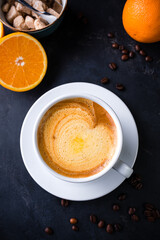 cappuccino coffee with orange juice in a cup