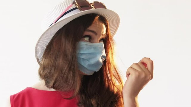 Pandemic restrictions. Vacation cancel. Astonished woman holding ticket ready to summer travel abroad surprised flight revoke due virus epidemic isolated on white.