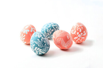 Coral and turquoise easter eggs with white floral pattern, modern spring celebration concept
