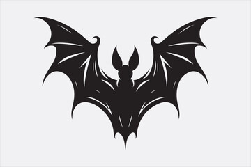 A black silhouette of a flying bat with outstretched wings.