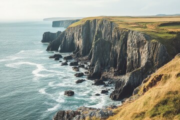 Rugged coastline with dramatic cliffs and soft waves gently crashing against the rocky shore