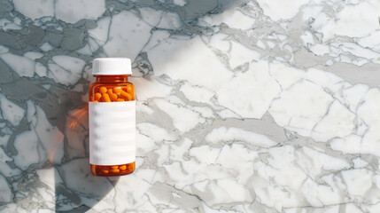 Orange pill bottle with white label filled with capsules on a marble background, depicting the essential nature of daily health management.
