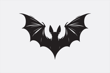 A black silhouette of a flying bat with outstretched wings.