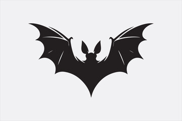 A black silhouette of a flying bat with outstretched wings.