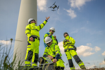 Fototapeta premium electric engineer or technician employed for inspection, maintenance, and repair of wind turbines for clean, sustainable energy and green ecological power concepts.alternative renewable wind energy 