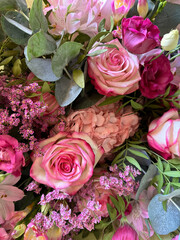 A vibrant floral arrangement featuring pink roses, delicate carnations, and lush greenery. Perfect for romantic, elegant designs or nature-inspired projects. Ideal for backgrounds, Valentines day