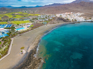 Aerial drone view of Las Playitas fishing town and the beach, Fuerteventura, Canary Islands