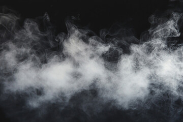 Fototapeta premium White smoke on a black background, creating an abstract, foggy effect