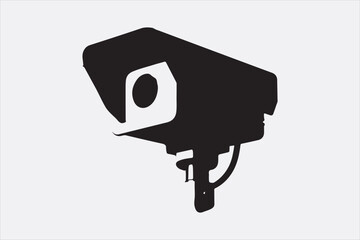 Silhouette of a security surveillance camera mounted on a wall.