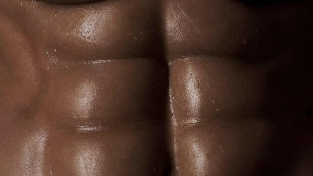 Six pack. Perfect abs, shoulders, and chest. Close up the Abs. Closeup torso. Ab. Muscular torso and ripped abs. Sexy male muscular body. Man with naked torso showing six pack abs.