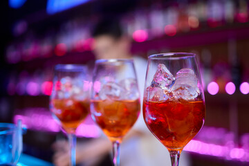 Refreshing and Exquisite Cocktails Being Expertly Poured at a Trendy Bar Environment