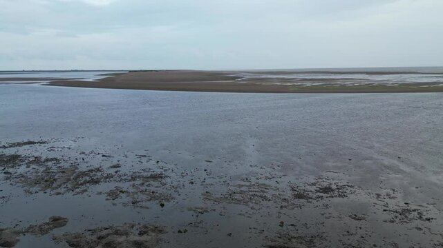 Beautiful High Angle Footage of Beach and Ocean Sea Side at Point Clear Village in Civil Parish of Saint Osyth, County of Essex, England, United Kingdom During Windy and Cloudy Day. May 22nd, 2024