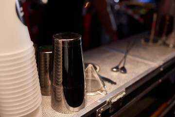 A Stylish and Attractive Bar Setup Featuring an Array of Essential Cocktail Tools and Glasses