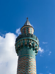 The Green Mosque in Iznik -Nicaea- Bursa, Turkey , The minaret of Green Mosque, Blue sky and clouds at background