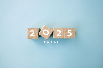 2025 on wooden blocks. New Year start concept.