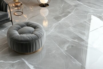 A polished grey marble floor with subtle white veining, matched with a modern velvet ottoman and designer lighting.