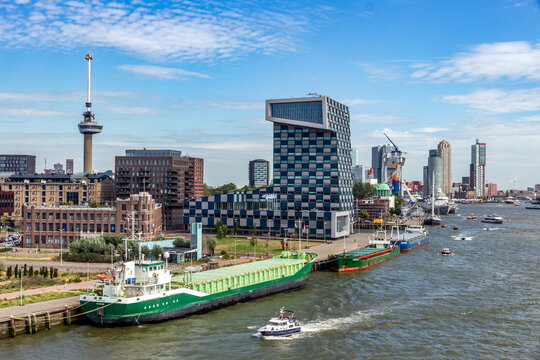 Ships and the STC Building on Lloydstraat street in Delfshaven district of Rotterdam. In the background is the Euromast the buildings at Kop van Zuid. Rotterdam, The Netherlands