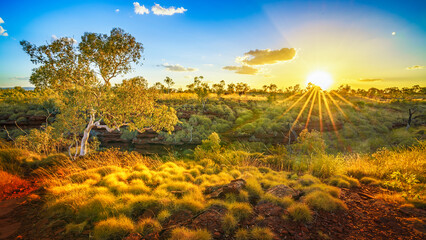 sun at sunset over joffre gorge in karijini national park, western australia