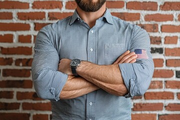 Obraz premium Man wearing a blue shirt with a white stripe and a black watch