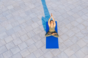 Calm female stretching hands on mat