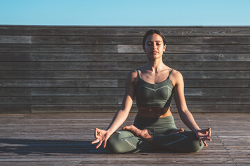 Meditative woman in lotus position