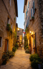 Beautiful street of tuscan Pienza town by night , Italy