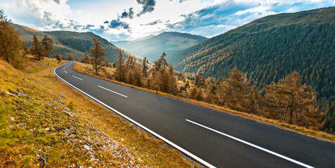 Asphalt road in Austria, Alps in a beautiful summer day, Nockalmstrasse.