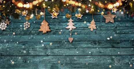 Christmas background with fir tree and decoration on dark wooden board