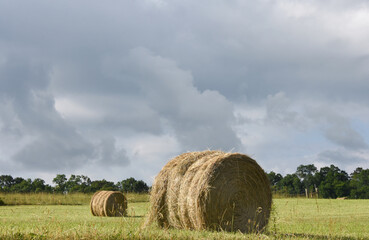 Bales of Hay and Rain Clouds