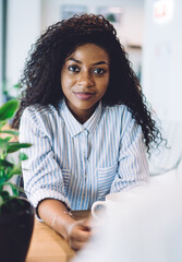 Smiling black woman looking at camera