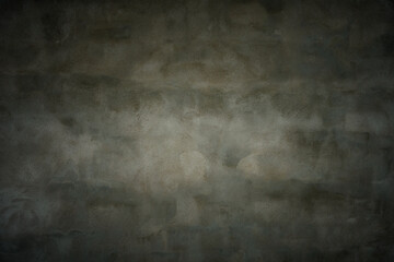 dark textured background from wall with grey spotted rough plaster and gradient vignette. artistic moody backdrop or blank for beautiful creative design