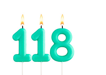 Green birthday candle on white background - Candle number 118