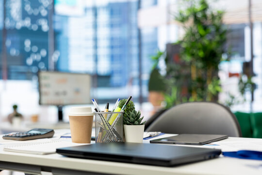 Close up on laptop in empty financial department office used for budgeting, forecasting, and financial analysis purposes. Notebook device on desk in bright modern company workspace - Powered by Adobe