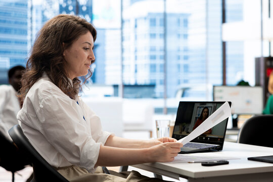 HR employee in remote call determining if candidate possesses skills and experience needed to fulfil role. Employer discussing with person in videoconference meeting, evaluating qualifications