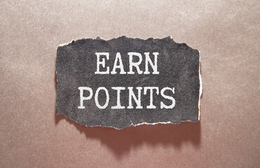 EARN POINTS text on notebook with pen on a chart background