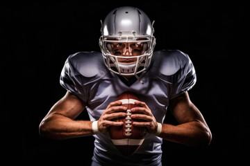 A football player is holding a football and wearing a helmet. Concept of strength and determination, as the player is ready to take on the challenge of the game