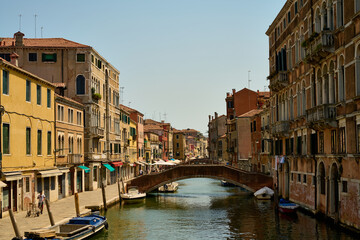 Venice and its canals ,boats,sculptures and birds