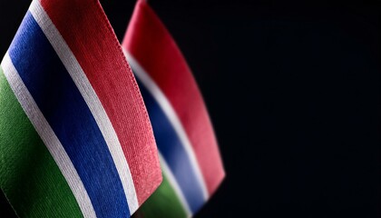 Fototapeta premium 小さなガンビアの国旗と暗い背景。(Gambia flag and dark background.) 