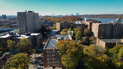 This location in the Bronx offers stunning views of lush greenery, a picturesque lake, and urban structures. Framed by the river, it showcases iconic bridges and the New York City skyline in the dista