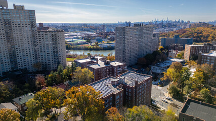 This location in the Bronx offers stunning views of lush greenery, a picturesque lake, and urban structures. Framed by the river, it showcases iconic bridges and the New York City skyline in the dista