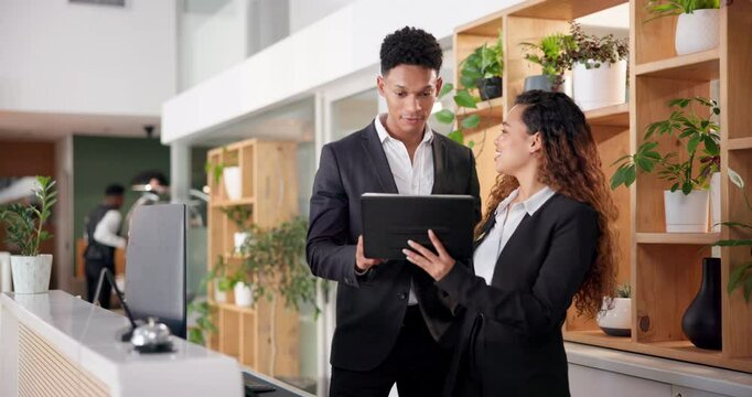 Hotel, reception and people with tablet in conversation for booking website, information or support. Man, woman and intern with tech at front desk for hospitality, online check in or help in training